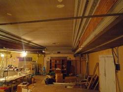 After the Star Theatre closed, an office supply store added a false ceiling in the auditorium, creating an upper level storage area.  This photo looks across the original ceiling toward the east wall of the auditorium.  The proscenium and stage are behind the wall on the right.
